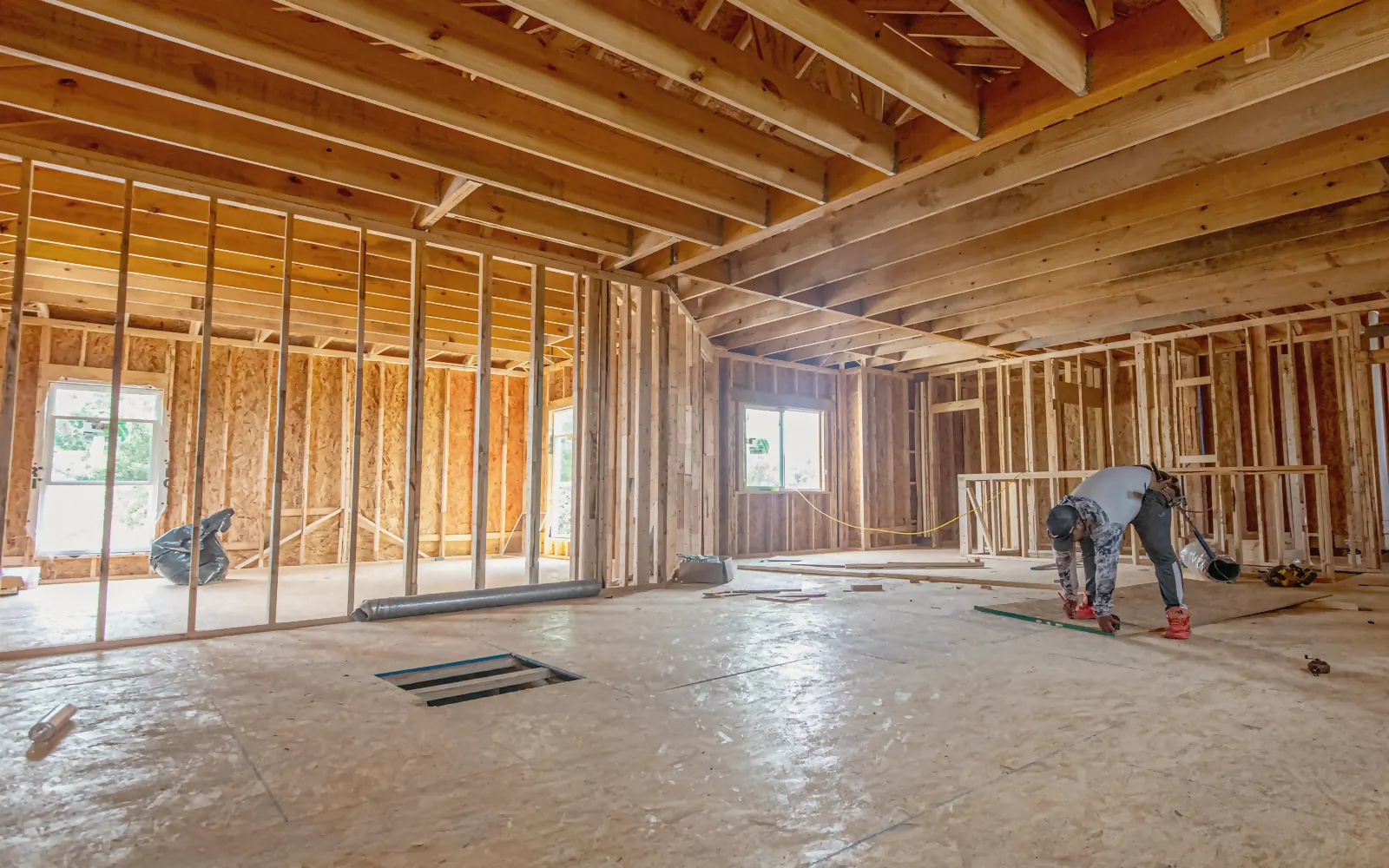 The wooden frame of a house under construction, before any finish is chosen